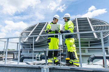 Professional Worker Teamwork Servicing HVAC building cooling tower, Industry air conditioner service