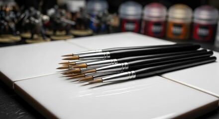 Bundle of assorted miniature painting brushes with fine tips and metal ferrules for detailed craftwork