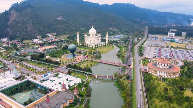 Captivating aerial view of Jaime Duque Park in Cundinamarca, featuring a river and a large structure resembling the Taj Mahal.