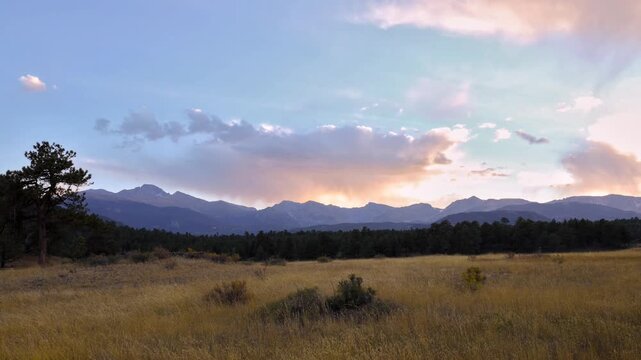Time lapse video of clouds rolling over the Rocky Mountains at sunset