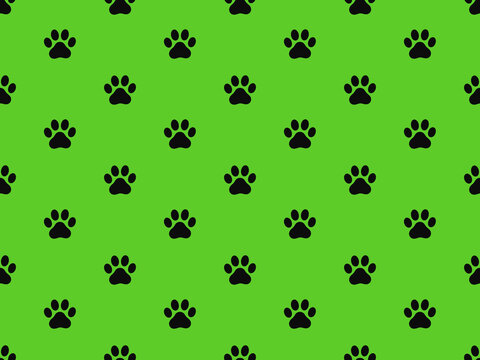 Cat paw prints in simple seamless pattern on green background