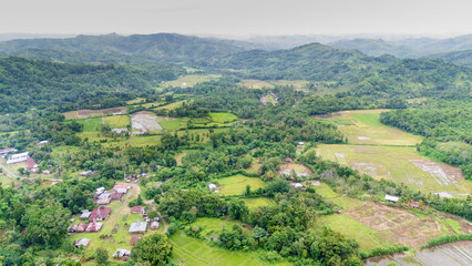 Obraz premium Sumba, Indonesia – 01. 16. 2026 – Praing Kareha Village in East Sumba is surrounded by dense forests, home to the Laputi Waterfall. On the other side, you can see the rice fields.