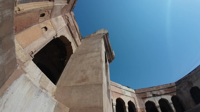Symmetrical stone corridors and arched galleries inside the historic Gol Bawdi stepwell.
Capturing the magnificent architectural depth and ancient water conservation system of Farrukh Siyar's reign