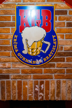 KGB Pub Bratislava entrance with signage and red brick street facade view
