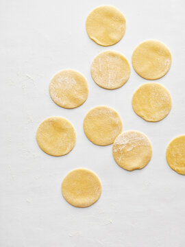 The image shows circular dough pieces ready for cooking. Ideal for restaurant menus, food blogs, and cooking videos