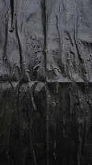 Wet Torn Poster Paper on Dark Stone Wall &ndash; Urban Grunge Texture Background