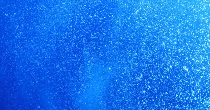 air bubbles slow  underwater coming up scenery dark blue and sun shine ocean scenery from scuba  divers backgrounds