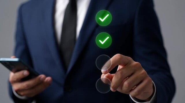 Businessman in blue suit interacting with virtual interface on smartphone