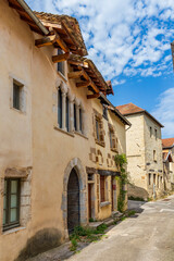 Obraz premium Medieval street Crémieu, Ain department, France. The town offers traditional architecture with its narrow medieval streets and houses since XIIe century.