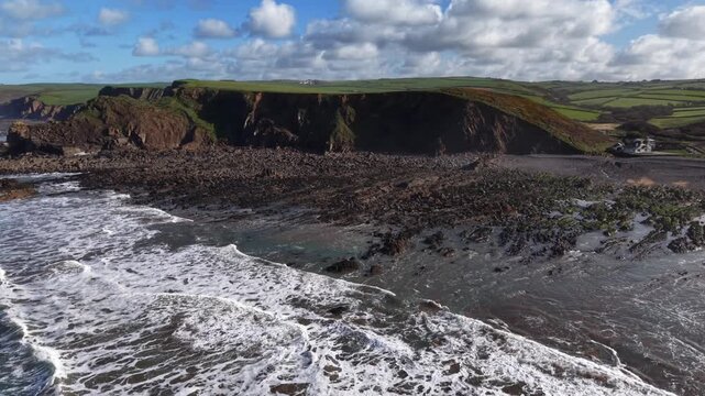 Tide coming back in at Northcott Mouth beach Cornwall