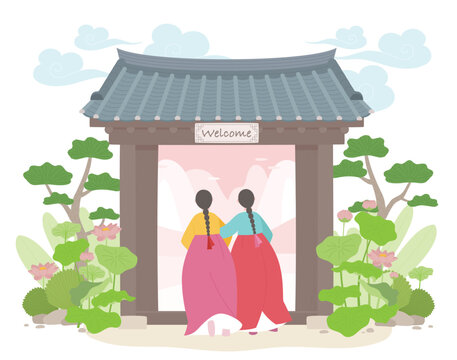 Two women in traditional korean hanbok standing before a gate