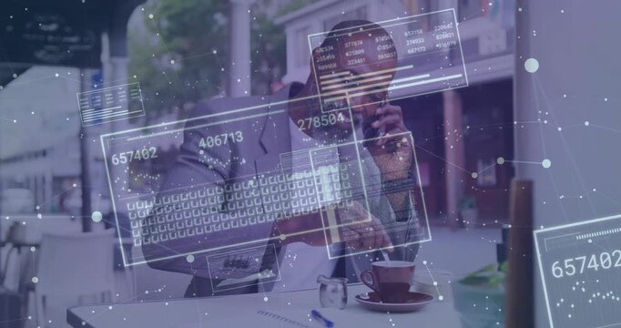 Executive handling call at cafe, holding phone, stirring cup while call initiating HUD overlays