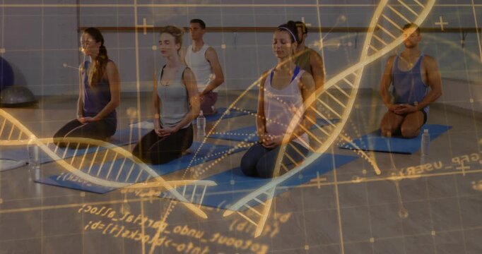 Group meditating on blue mats in guided yoga session while DNA helix drifting overlapping group