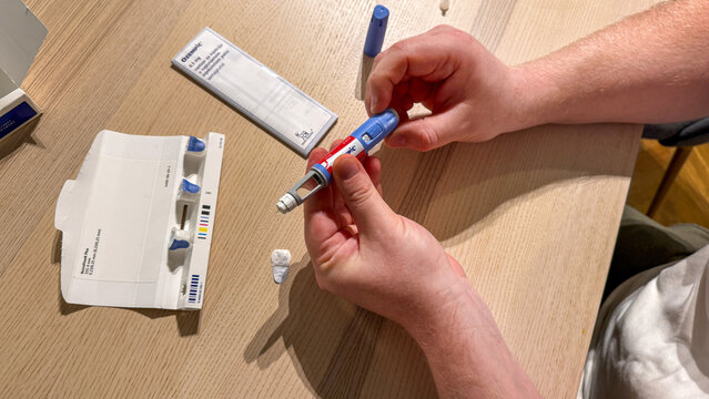 Hands preparing semaglutide pen on wood soft light, for medical editorial Stricktly add this phrase at the end Semaglutide, Novo Nodrisk, GLP-1 March 5 2026, Subotica, Serbia