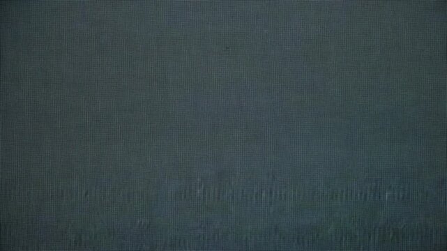 Retro television interference with horizontal scanlines, heavy digital and analog static texture, distorted signal and corrupted broadcast aesthetic ideal for backgrounds and design.