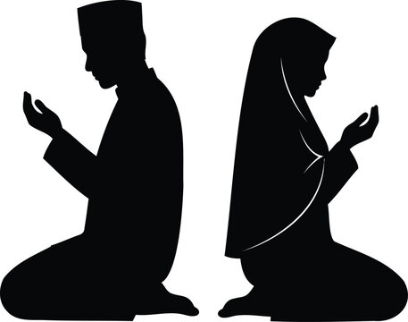 Silhouette of two people praying during the holy month of ramadan