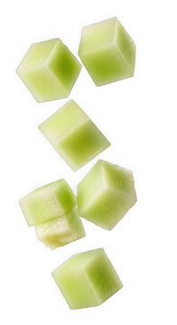 Floating green melon cubes scattered in various directions isolated on transparent background