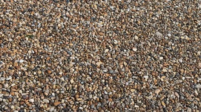 Colorful dry stone shingle surface aerial