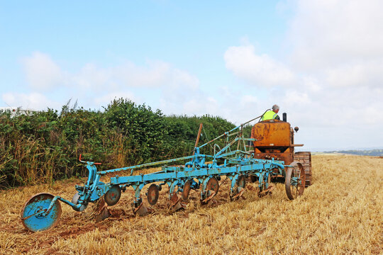 Vintage tractor ploughing a field	