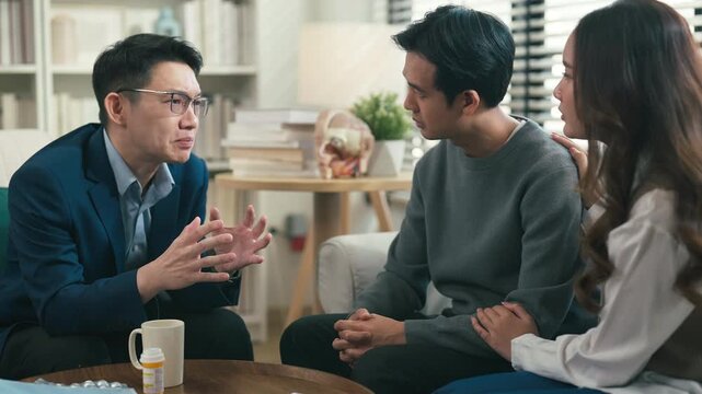 couples therapy session, a marriage counselor consults with a young couple for family therapy, offering relationship counseling, marriage help, family support, anxiety therapy, depression support	