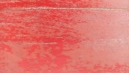 Fototapeta premium Weathered Red Painted Wood Texture. Close up of aged red painted wooden surface with peeling paint and distressed texture