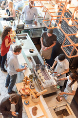 Bustling cafe with diverse patrons.