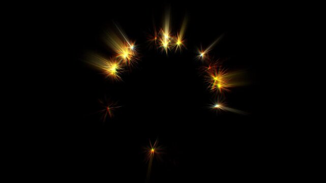 Golden sparks swirl in a circular frame. Bright streaks explode outward from glowing points