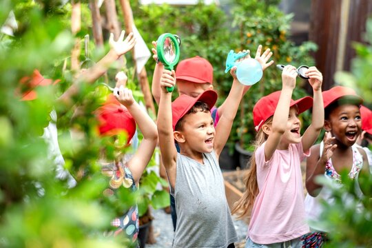 Joyful children exploring nature together.