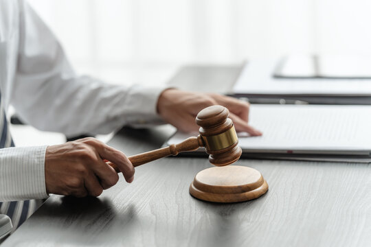 Lawyer businessman analyzes legal brief in office