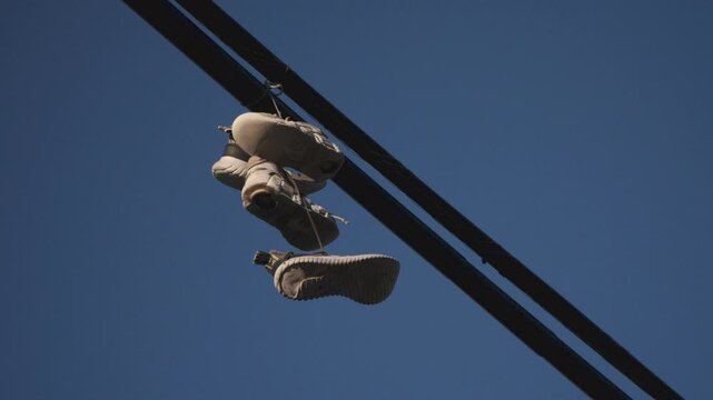 Sneakers hanging on a telephone line in Brooklyn