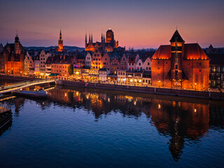Beautiful old town of Gdansk with historic architecture over the Motlawa river at dusk, Poland