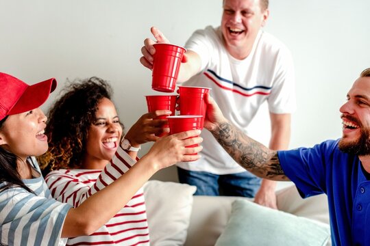 Friends celebrating with red cups.