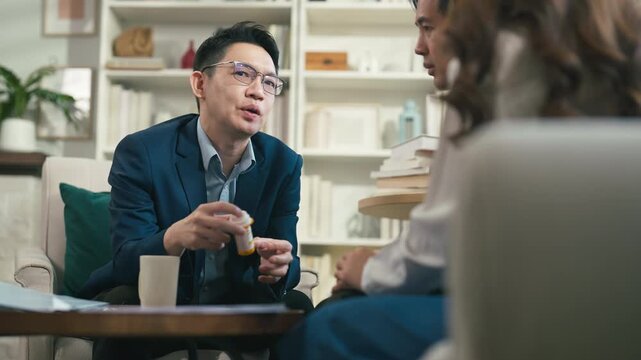 couples therapy session, a marriage counselor consults with a young couple for family therapy, offering relationship counseling, marriage help, family support, anxiety therapy, depression support	
