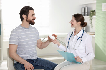 Man having appointment with doctor in clinic