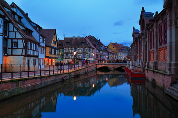 Fototapeta premium Charming Alsace France Town at Twilight with Reflective River