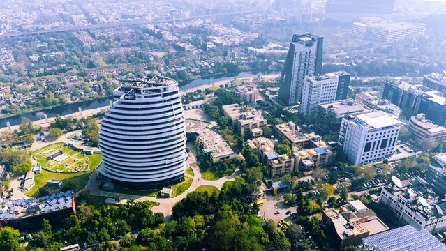 Aerial drone view of Noida city skyline with modern residential towers and urban infrastructure in Delhi NCR, Uttar Pradesh, India.