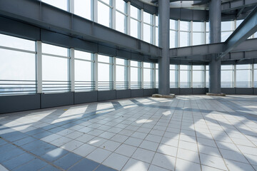 Obraz premium Modern steel structure interior space with glass curtain wall and ample natural light