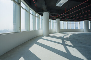 Obraz premium Empty modern office space in high-rise building with excellent natural lighting and large windows