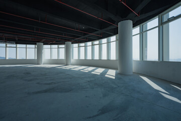 Obraz premium Spacious empty office interior with abundant natural light and modern architectural elements
