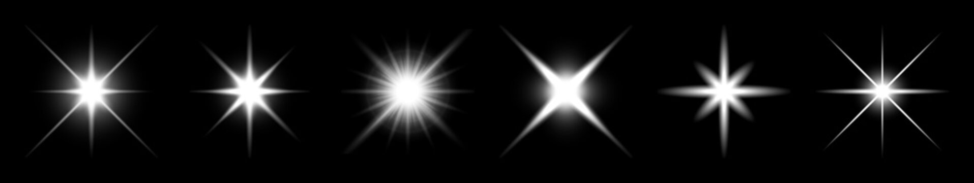 Bright starbursts on black background