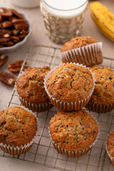 Banana muffins with pecan nuts freshly baked on a cooling rack