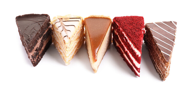 Pieces of various cakes isolated on white