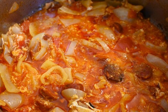 Close-up of traditional Hungarian lecs&oacute; cooking in a pot. Homemade vegetable dish made with pepper, tomato and onion representing simple traditional food and home cooking concepts.