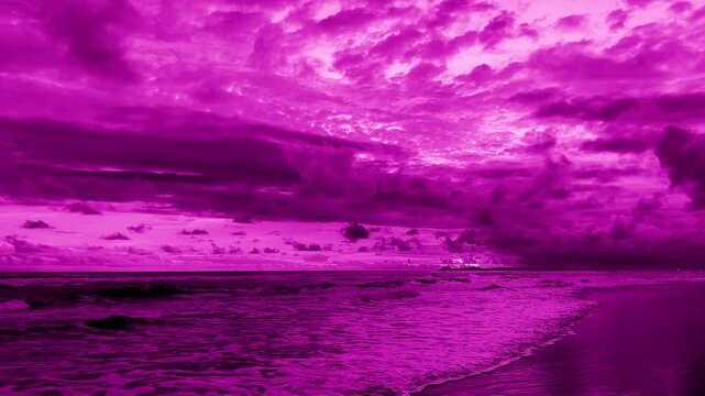 ocean waves and cloudy sky. peaceful seascape in magenta tones