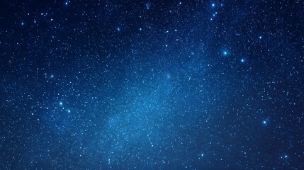 A stunning celestial scene of a starry night sky with a vibrant blue nebula