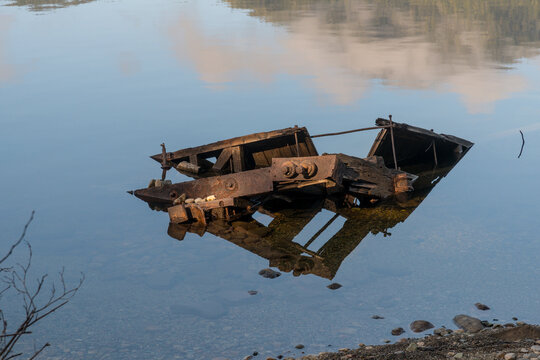 Canada, BC, Vancouver Island, Telegraph Cove.   Old logging equipment left abandoned in Nimpkish Lake. 