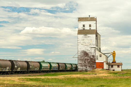Canada, Saskatchewan, Kincaid. Classic grain elevator beside the railway tracks in the Canadian prairies.