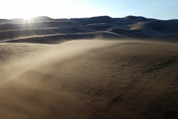 Sunset winds sculpt sandy cascades at Great Sand Dunes National Park, Colorado, USA © Elaine