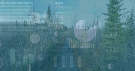 Naklejka premium Riding teen on bike on paved trail in woodland, with dark outerwear, helmet, HUD