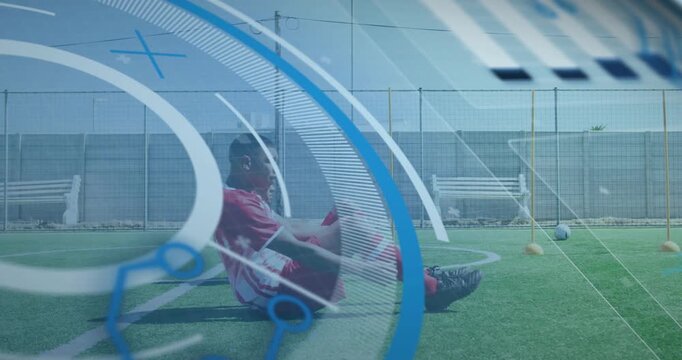 Player starting drill on turf, doing sit-ups for soccer fitness, with rotating overlay over players